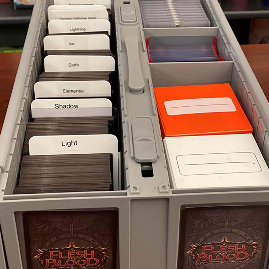 BCW card organizer with labeled compartments and a red card inside, on a wooden surface.