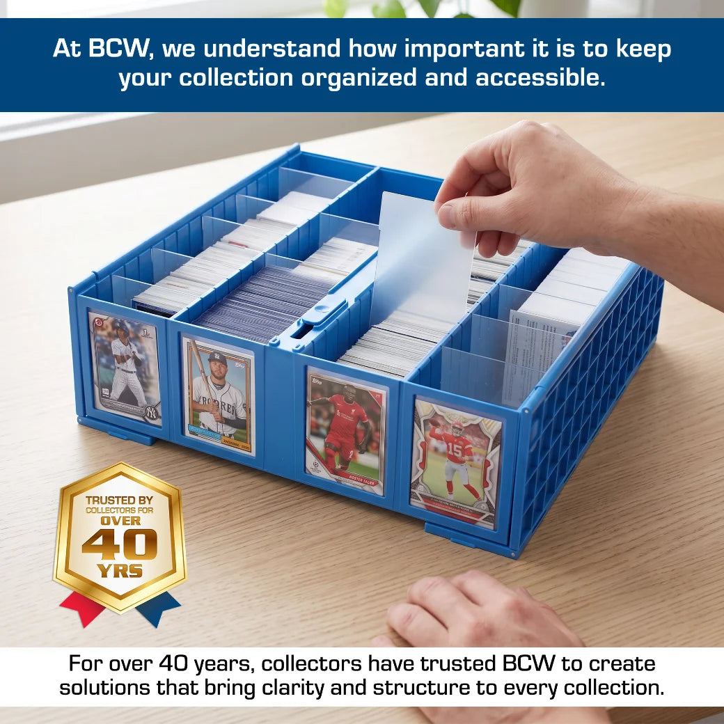 A BCW blue plastic card organiser tray with multiple compartments and card slots, shown on a wooden table with a hand inserting a card. The image includes promotional text for BCW Supplies and a gold trust badge.